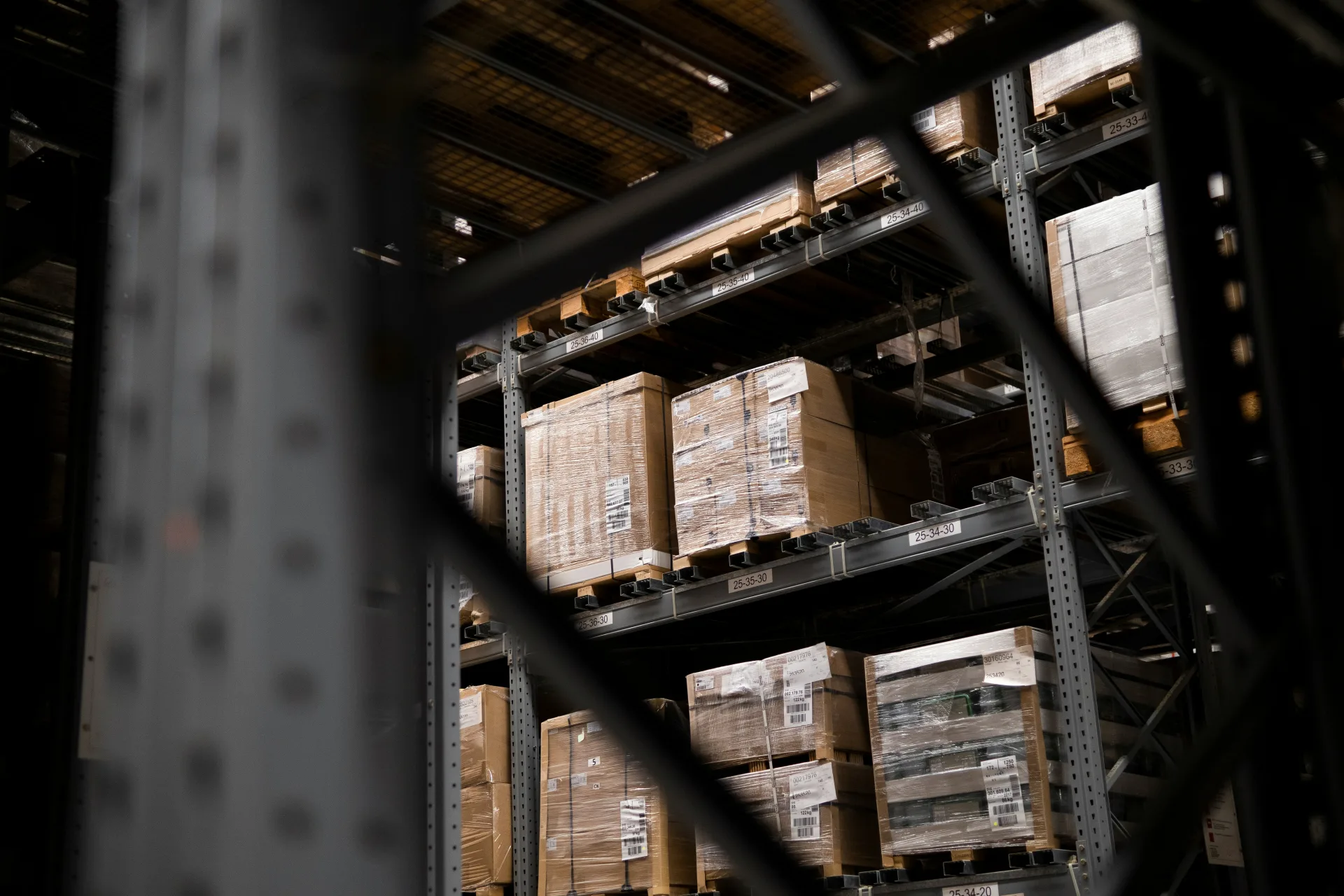 A supply warehouse stacked with cartons and pallets
